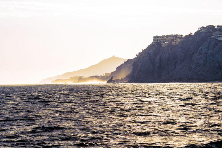 Moody coastal landscape photography with dark, high-contrast visual aesthetics.