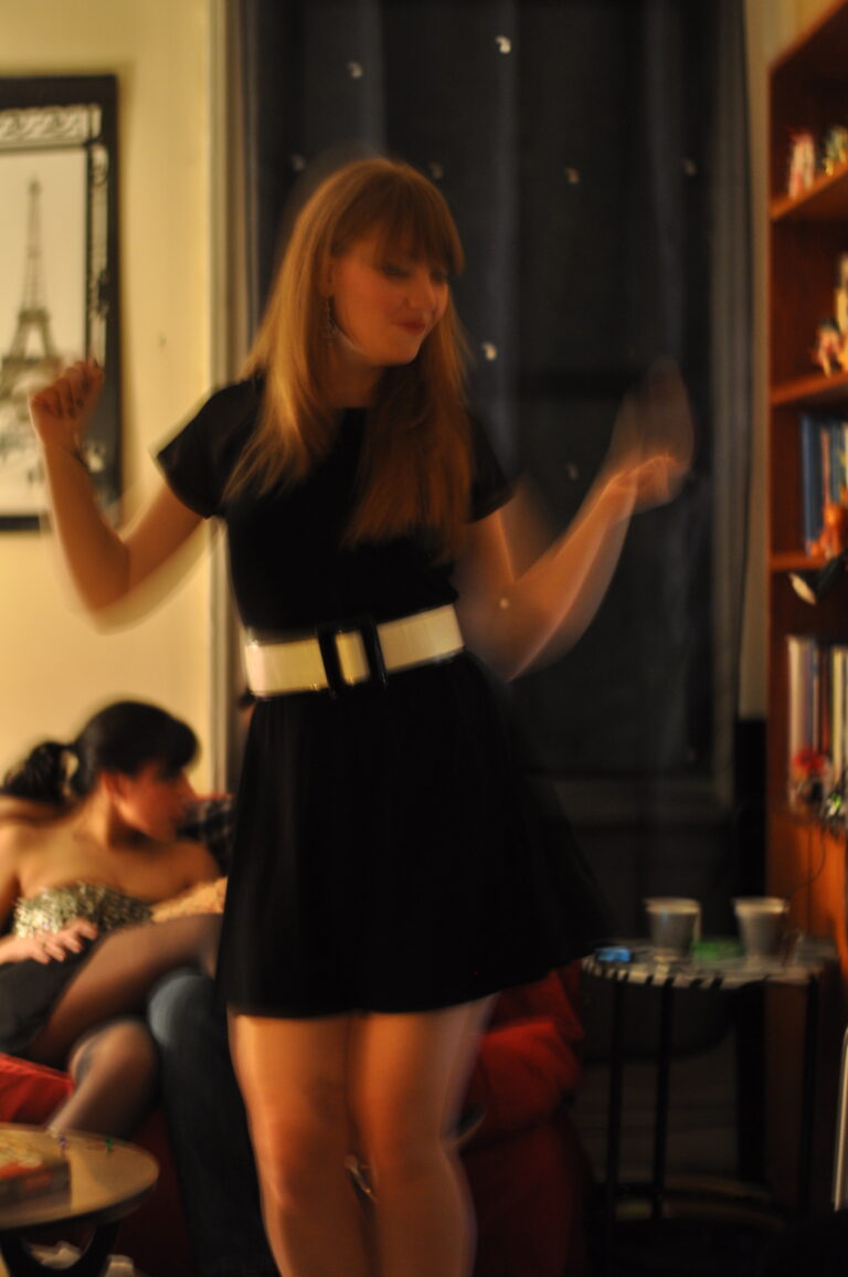 Dynamic motion blur photography capturing energetic movement and warm ambient lighting, representing fluid visual aesthetics by Visuals for Vigil.